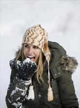 A woman eating snow