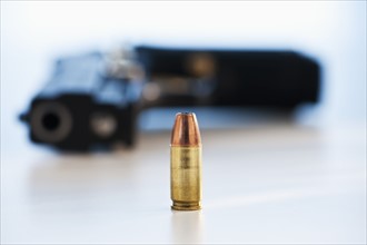 A handgun with ammunition