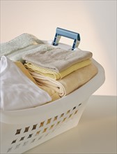 A laundry basket full of clothes.