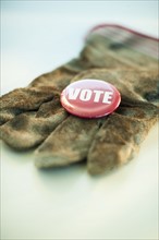 A glove with a Vote button on it.