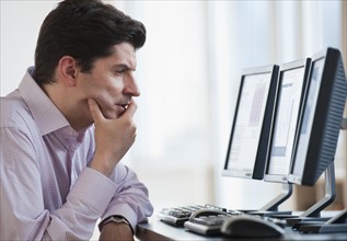 A businessman using a computer.
