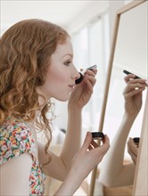 Woman putting on makeup