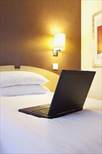 Laptop on bed