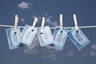 Social security cards on clothes line