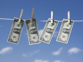 Dollars on clothes line