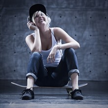 Female skateboarder on phone