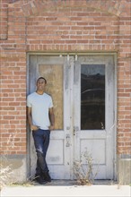 Young man at abandoned building