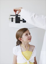 Doctor weighing child