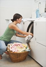 Woman washing clothes.