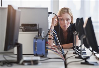 Woman with networked computers.