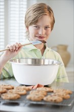 Child baking cookies.