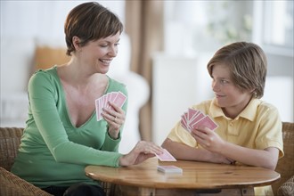 Mother and son playing cards.