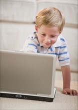 Child playing on computer.