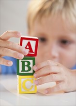 Child playing with ABC blocks.