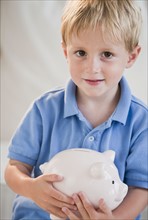 Child with piggybank.