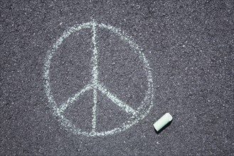 Peace sign on pavement
