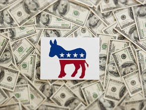 Democratic party symbol wtih US dollars as background