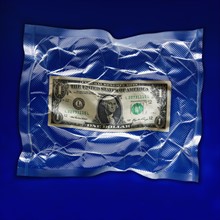 Shrink wrapped dollar bill