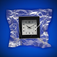 Shrink wrapped clock