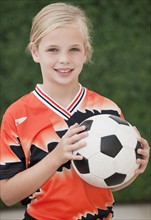 Child with soccer ball.