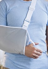 Man with arm in sling.