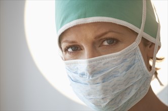 Female doctor with surgical mask.