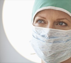 Female doctor with surgical mask.