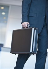 Businessman holding briefcase.