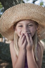 Girl wearing straw hat