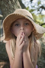 Girl wearing straw hat