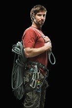 Portrait of male climber holding rope