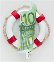 Ring bouy behind European currency