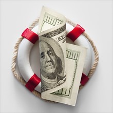 Ring bouy behind American currency