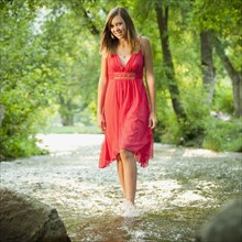 Portrait of woman walking in river