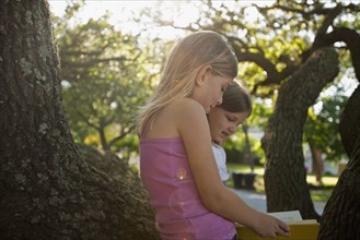 Girls reading outside