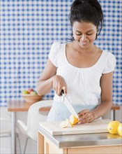 Woman slicing lemon