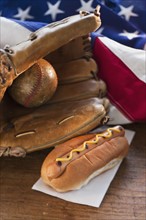 Baseball glove hotdog and American flag.