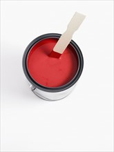Can of red paint