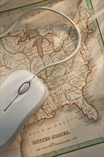 Antique map and computer mouse.
