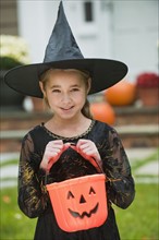 Girl dressed as witch.