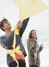 Couple flying kite