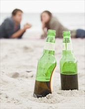 Bottles in sand