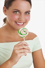 Woman holding lollipop