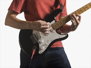 Person playing electric guitar
