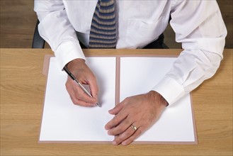 Man writing document