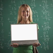 Student holding laptop
