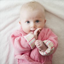 Portrait of baby girl in pink robe