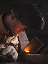 Steel worker doing quality check