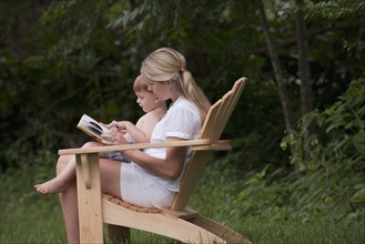 Woman reading to son