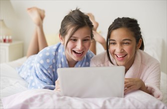 Girls looking at laptop.